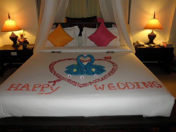 Flowers on bride and groom bed