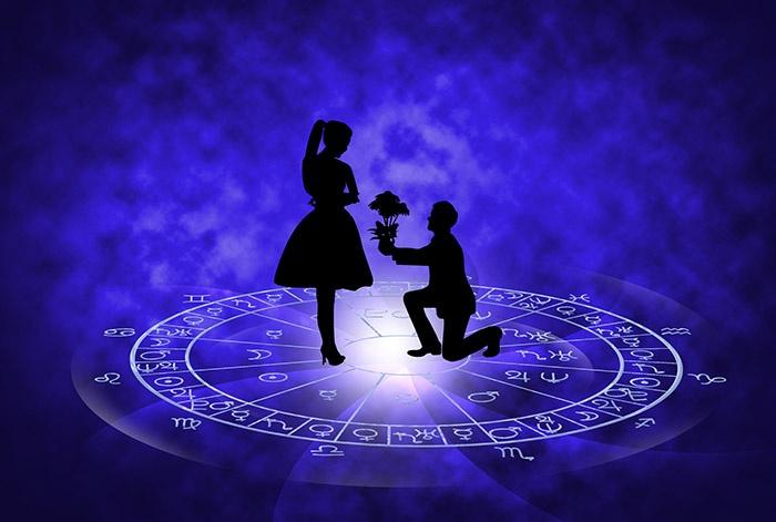 matching horoscopes for marriage with man down on one knee proposing inside astrology circle