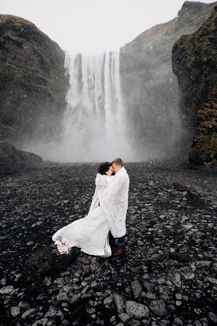 wedding couple at Skogafoss waterfall, Iceland