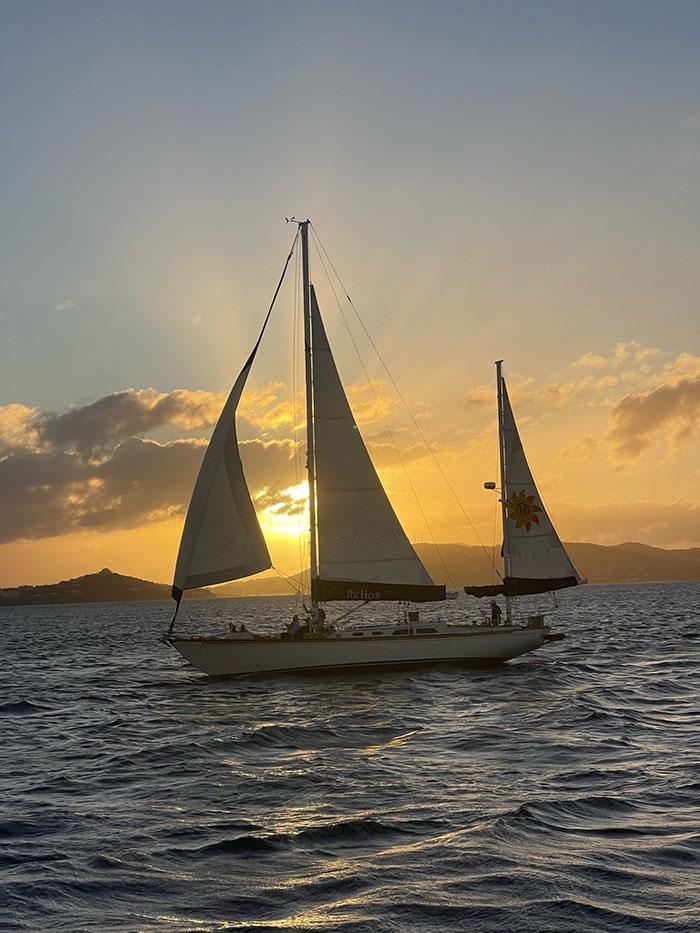 Helios sail boat at dusk out on the harbor of the USVI