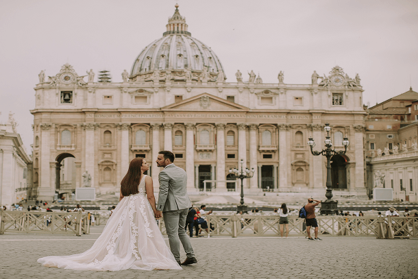 wedding abroad italy bride and groom infront of Saint Peter cathedral in Vatican italy 