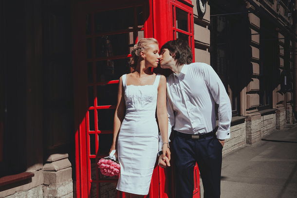 UK Wedding bride and groom infront of british phone box 