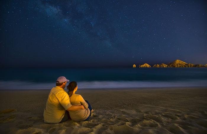 couple on beach at night in Cabo San Lucas, Mexico